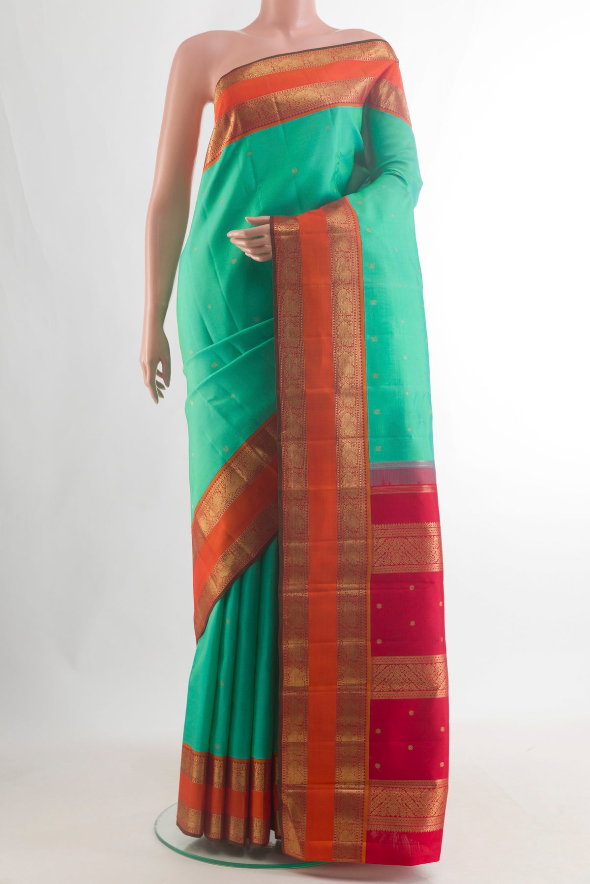 Pure Silk Pure Zari Sea Green Kanjivaram Saree with Zari Butta on the body and Zari Border.  displayed on a mannequin