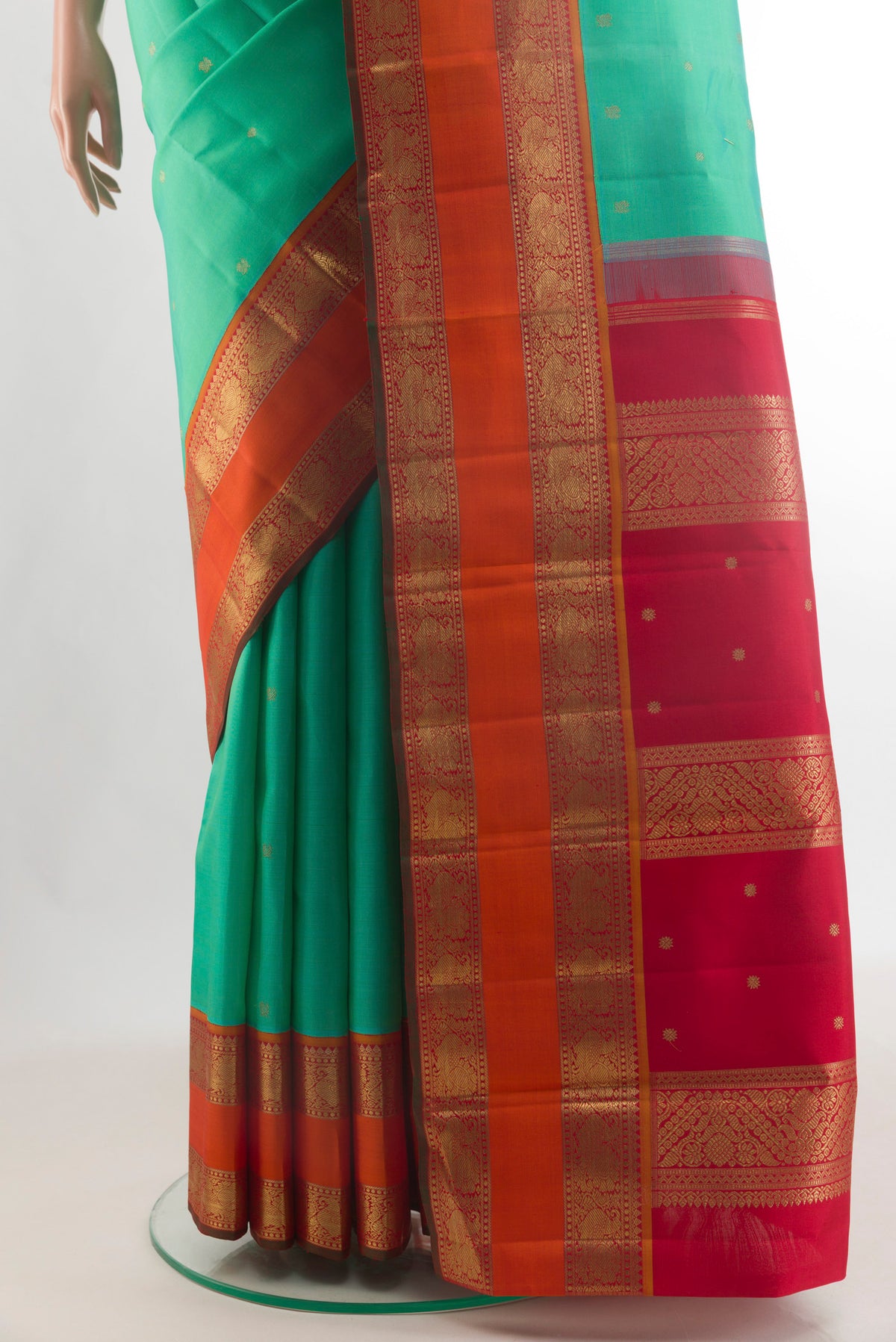 Pleats and pallu of Pure Silk Pure Zari Sea Green Kanjivaram Saree with Zari Butta on the body and Zari Border. 