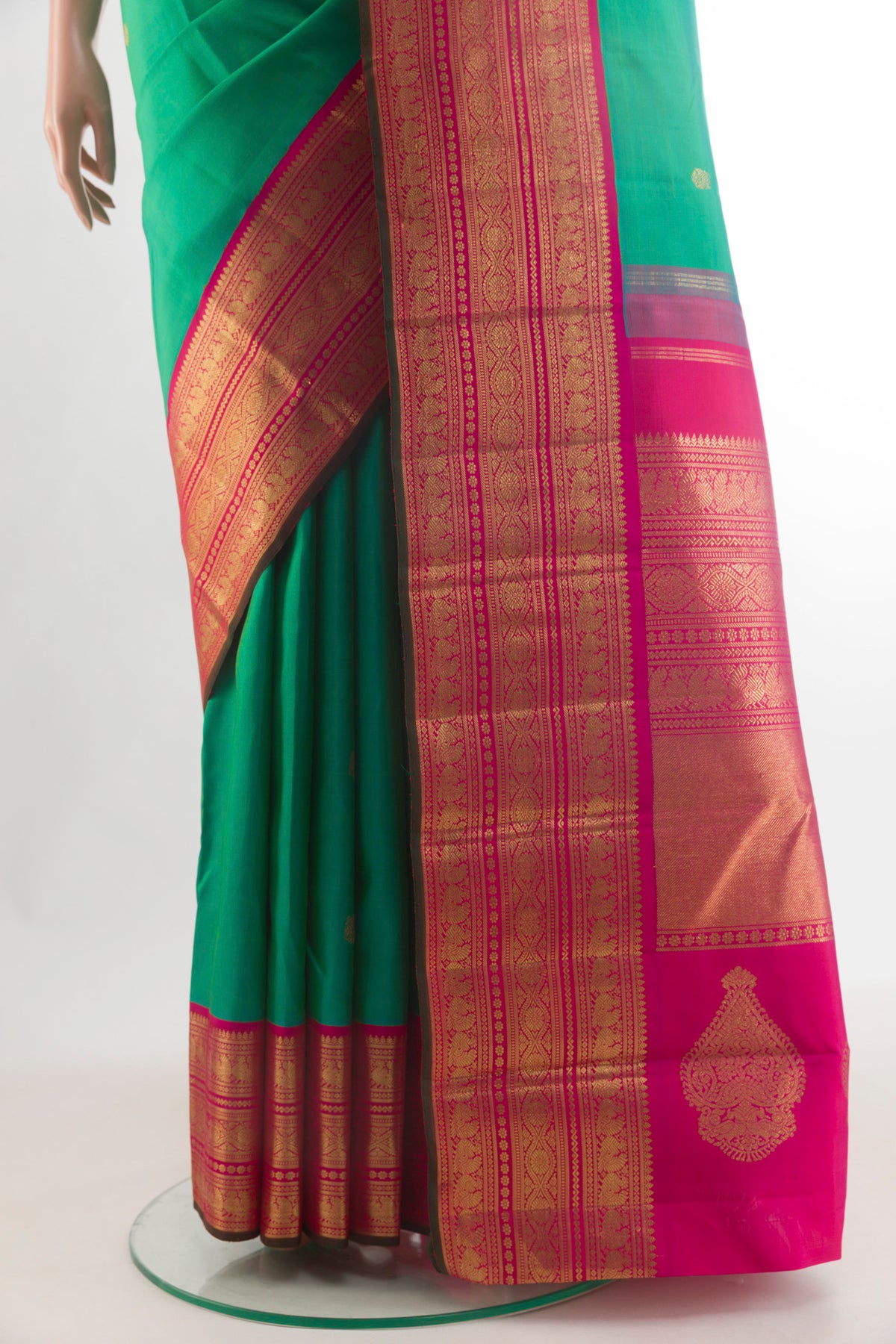 Pleats and pallu of Pure Silk Pure Zari Green Kanjivaram Saree with Zari Butta on the body and Zari Border. 