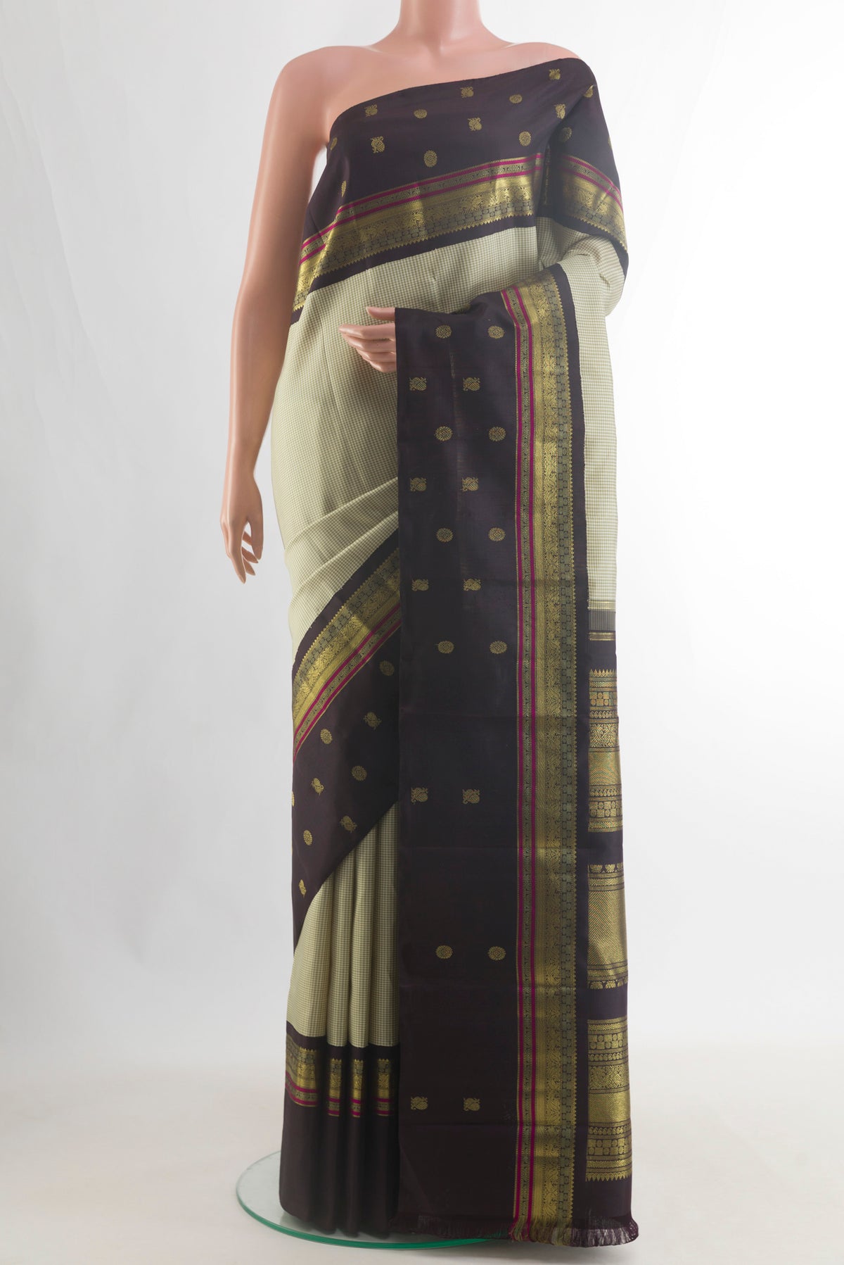 Pure Silk Pure Zari Sage Green Kanjivaram Saree with Checked design on the body and Zari Border.  displayed on a mannequin