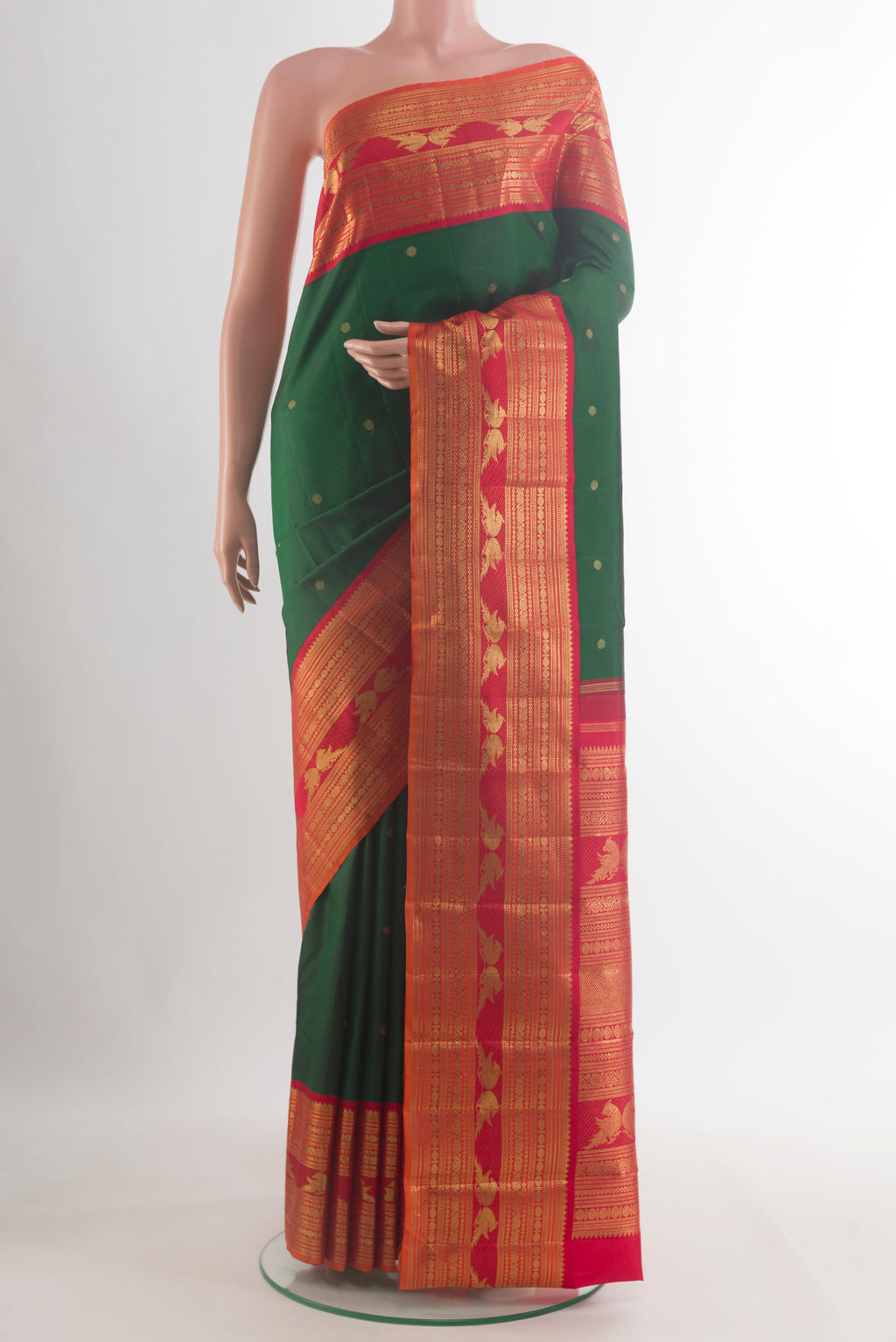 Pure Silk Pure Zari Green Kanjivaram Saree with Zari Butta on the body and Zari Border.  displayed on a mannequin