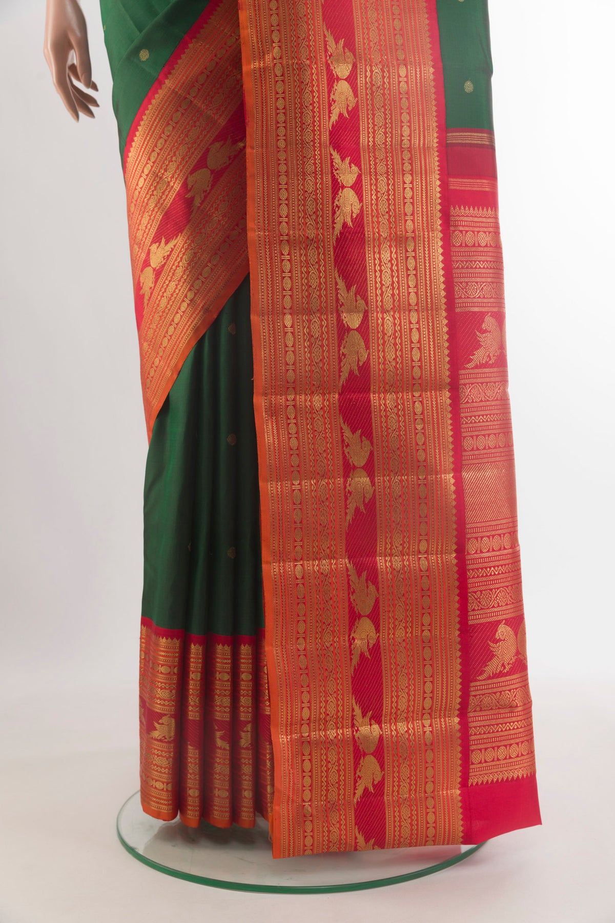 Pleats and pallu of Pure Silk Pure Zari Green Kanjivaram Saree with Zari Butta on the body and Zari Border. 