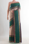 Pure Silk Pure Zari Cream Kanjivaram Saree with Zari Butta on the body and Zari Border.  displayed on a mannequin