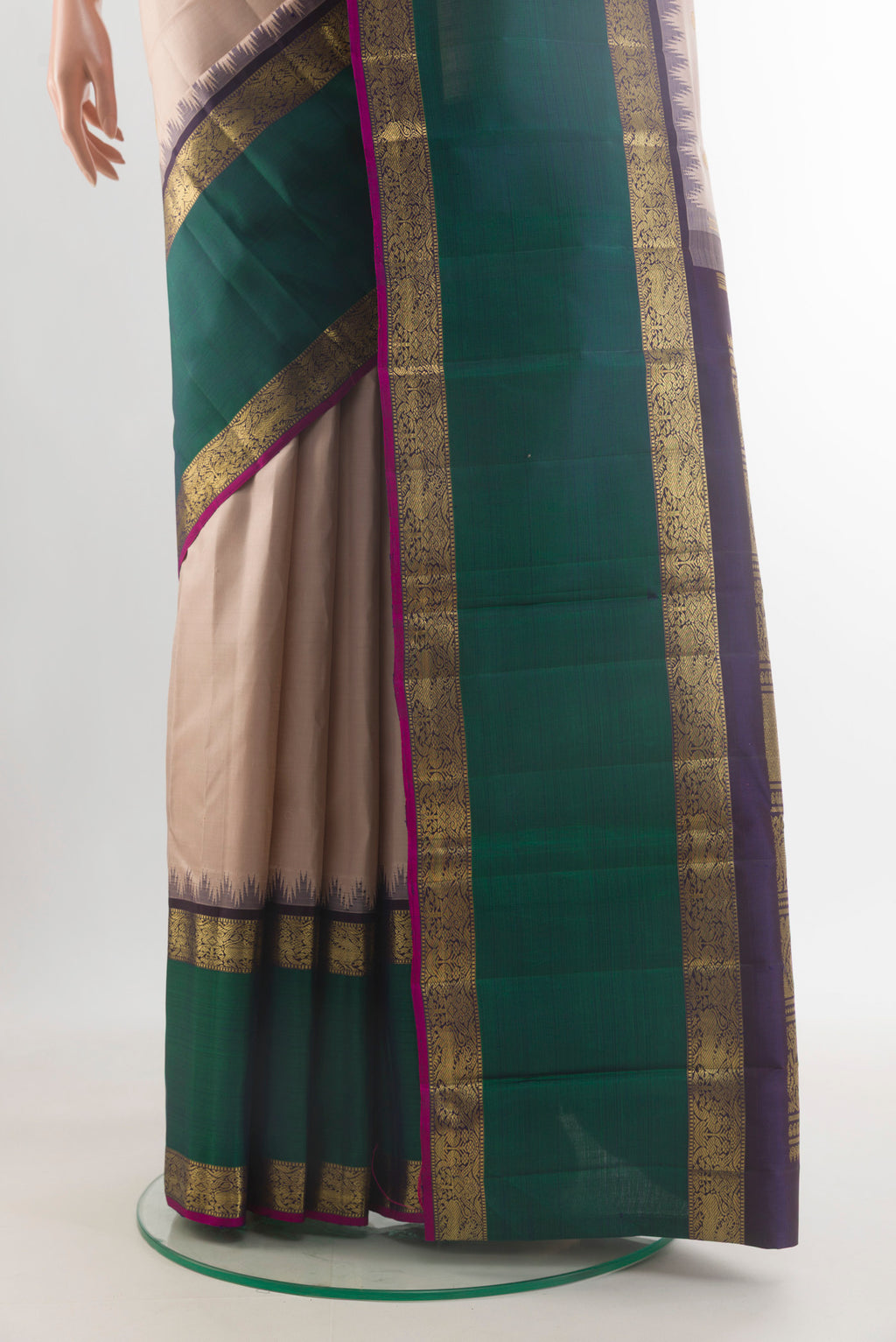 Pleats and pallu of Pure Silk Pure Zari Cream Kanjivaram Saree with Zari Butta on the body and Zari Border. 