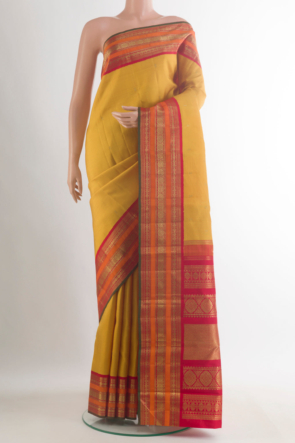 Pure Silk Pure Zari Yellow Kanjivaram Saree with Zari Butta on the body and Zari Border.  displayed on a mannequin