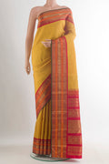 Pure Silk Pure Zari Yellow Kanjivaram Saree with Zari Butta on the body and Zari Border.  displayed on a mannequin