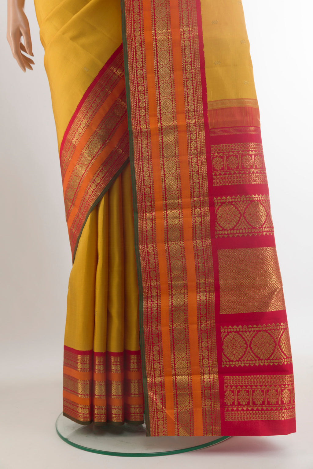 Pleats and pallu of Pure Silk Pure Zari Yellow Kanjivaram Saree with Zari Butta on the body and Zari Border. 