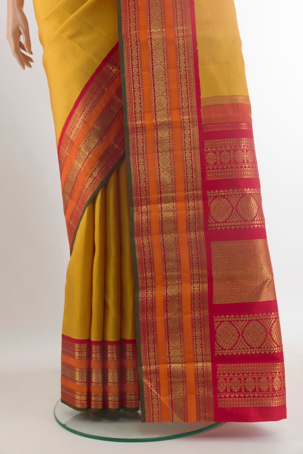 Pleats and pallu of Pure Silk Pure Zari Yellow Kanjivaram Saree with Zari Butta on the body and Zari Border. 