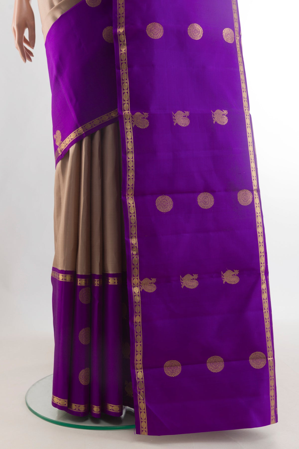 Pleats and pallu of Pure Silk Pure Zari Beige Kanjivaram Saree with Zari Butta on the body and Zari Border. 
