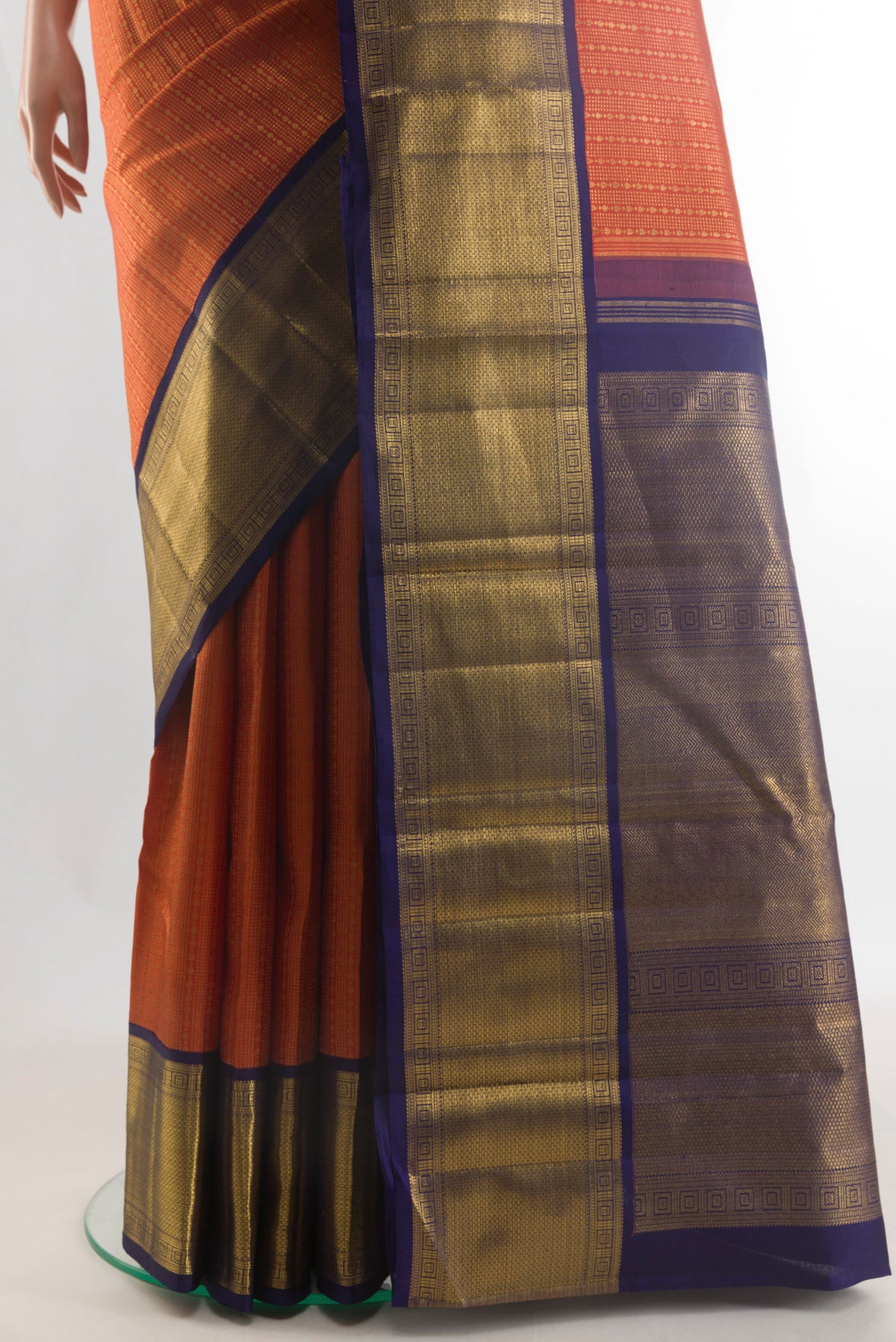 Pleats and pallu of Pure Silk Pure Zari Orange Kanjivaram Saree with Zari Brocade on the body and Zari Border. 
