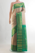 Pure Silk Pure Zari Beige Kanjivaram Saree with Zari Brocade on the body and Zari Border.  displayed on a mannequin