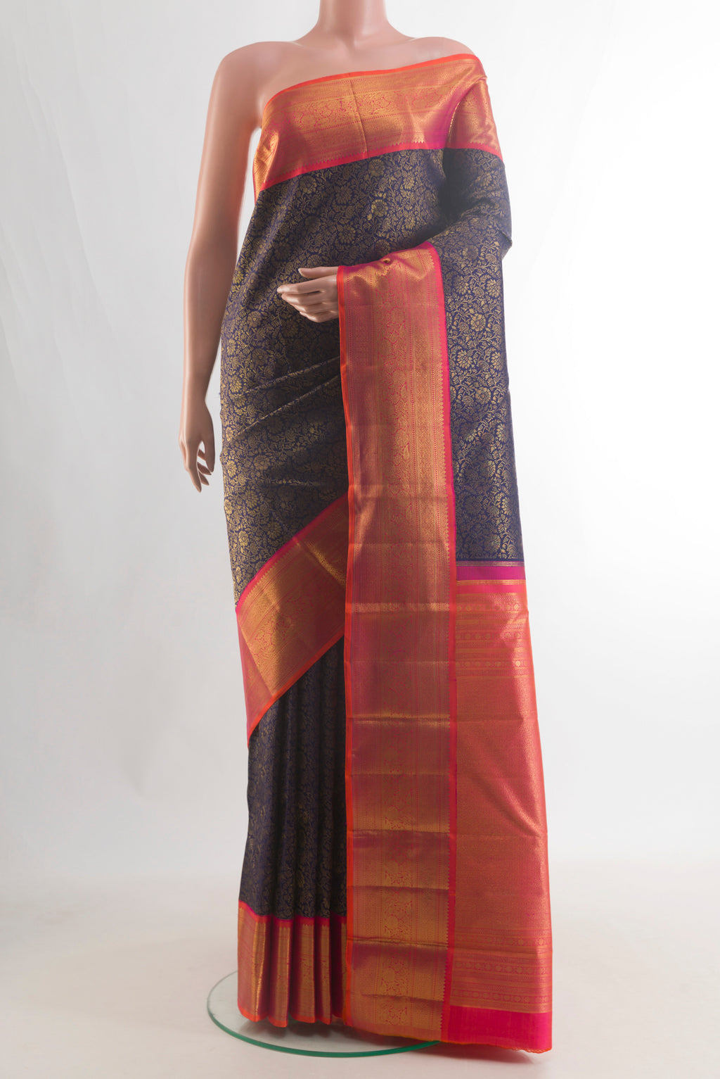 Pure Silk Pure Zari Navy Blue Kanjivaram Saree with Zari Brocade on the body and Zari Border.  displayed on a mannequin