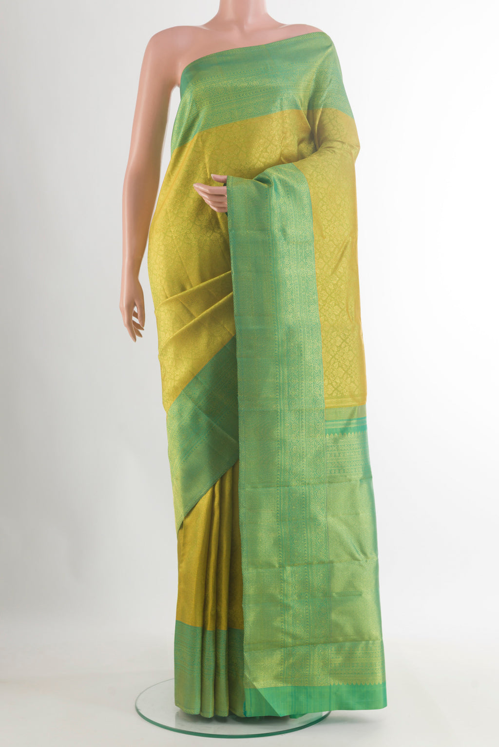 Pure Silk Acid Green Kanchipuram Saree with Zari Brocade on the body and Zari Border.  displayed on a mannequin