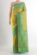 Pure Silk Acid Green Kanchipuram Saree with Zari Brocade on the body and Zari Border.  displayed on a mannequin
