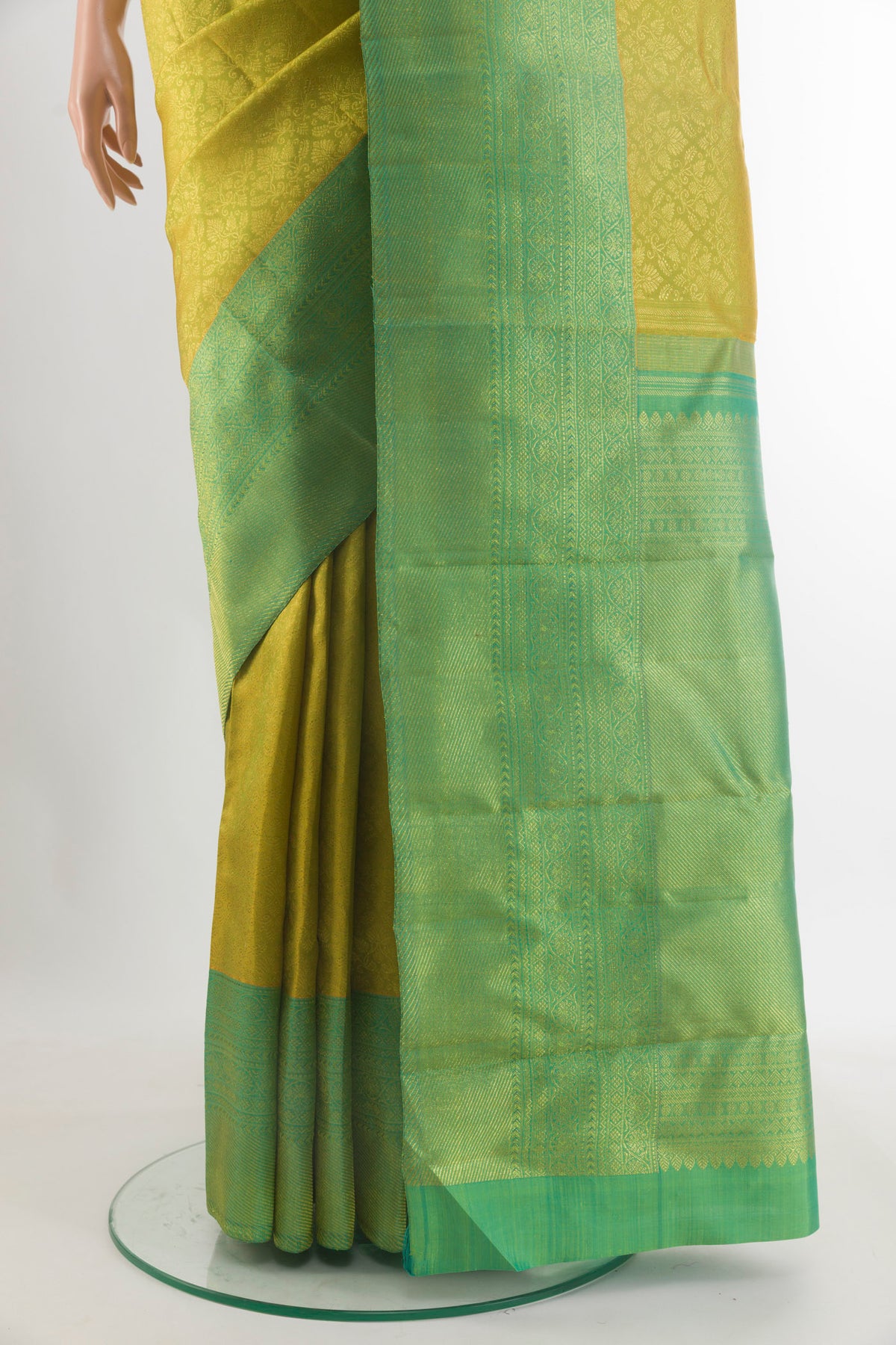 Pleats and pallu of Pure Silk Acid Green Kanchipuram Saree with Zari Brocade on the body and Zari Border. 