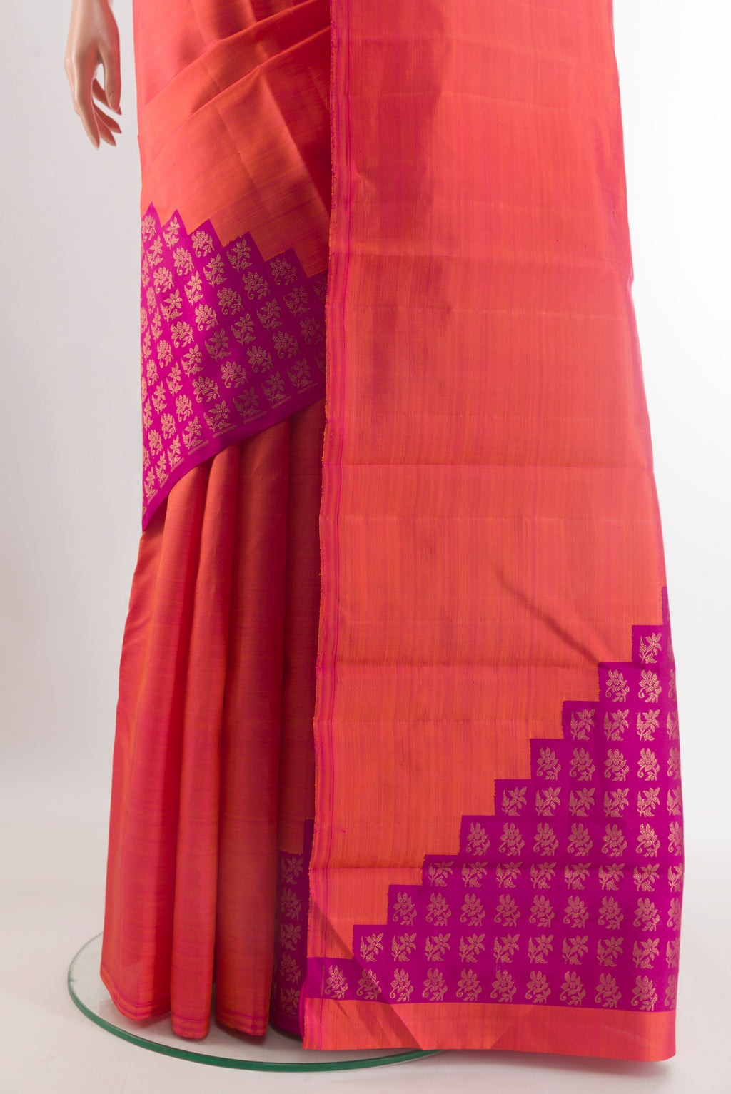 Pleats and pallu of Pure Silk Pure Zari Brick Orange Kanchipuram Saree with Plain Body and Without Border. 