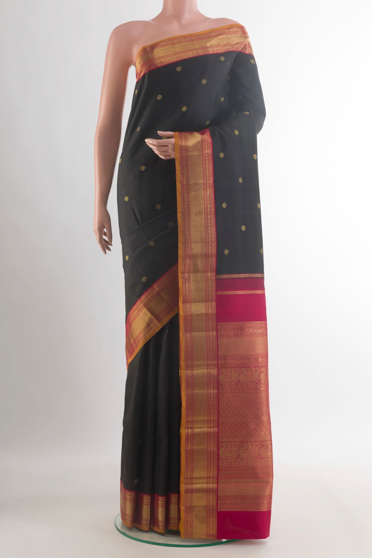 Pure Silk Pure Zari Black Kanjivaram Saree with Zari Butta on the body and Zari Border.  displayed on a mannequin