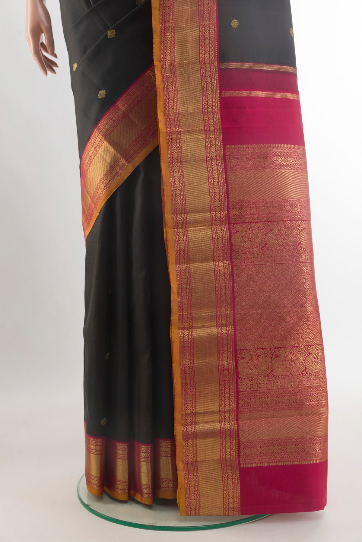 Pleats and pallu of Pure Silk Pure Zari Black Kanjivaram Saree with Zari Butta on the body and Zari Border. 