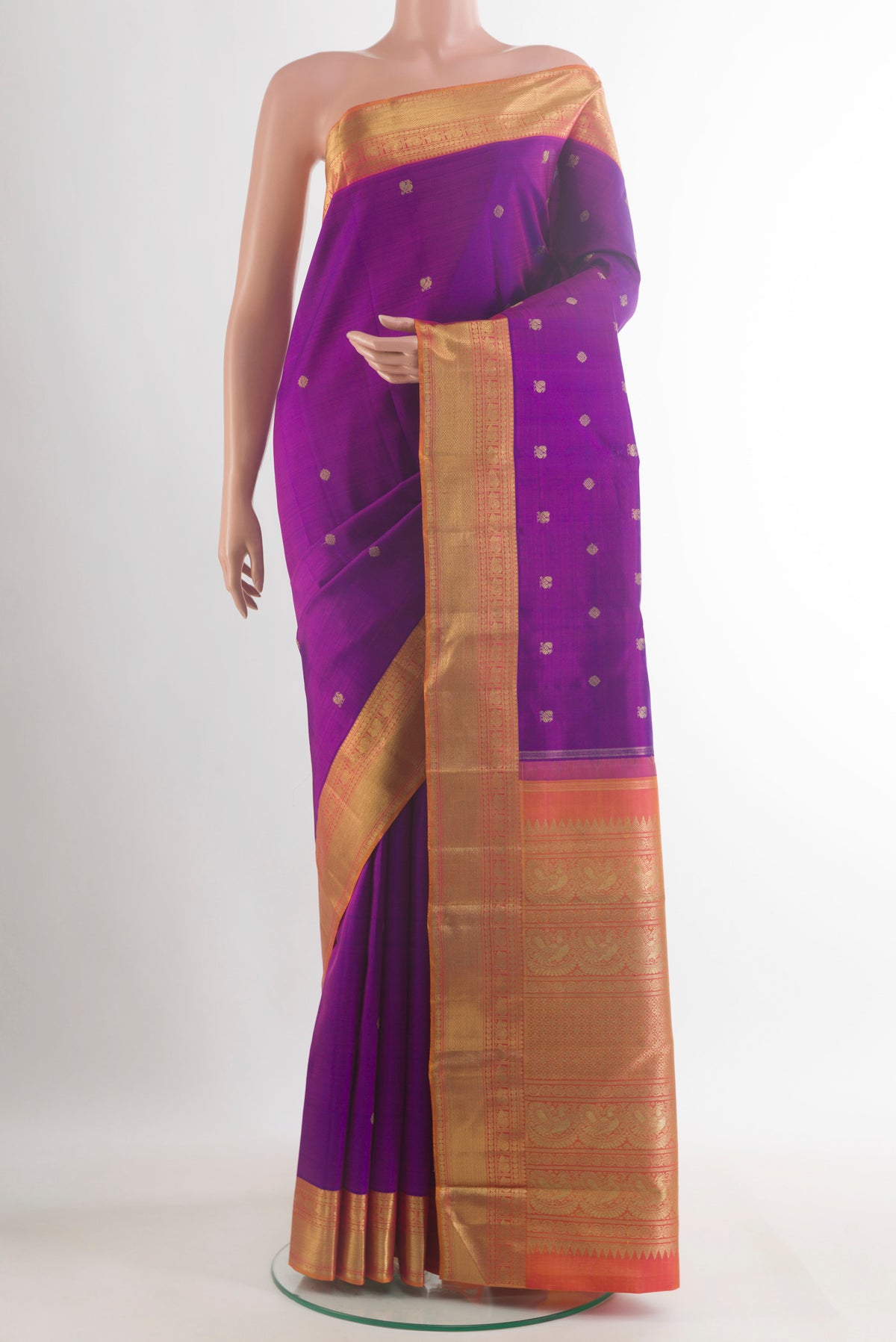 Pure Silk Pure Zari Purple Kanjivaram Saree with Zari Butta on the body and Zari Border.  displayed on a mannequin