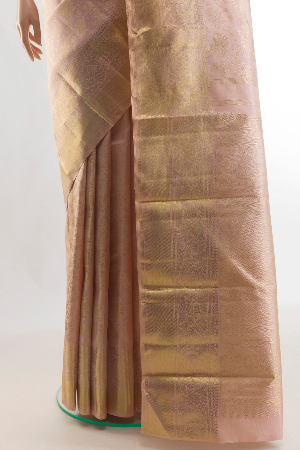 Pleats and pallu of Pure Silk Pure Zari Peach Kanjivaram Saree with Zari Brocade on the body and Zari Border. 