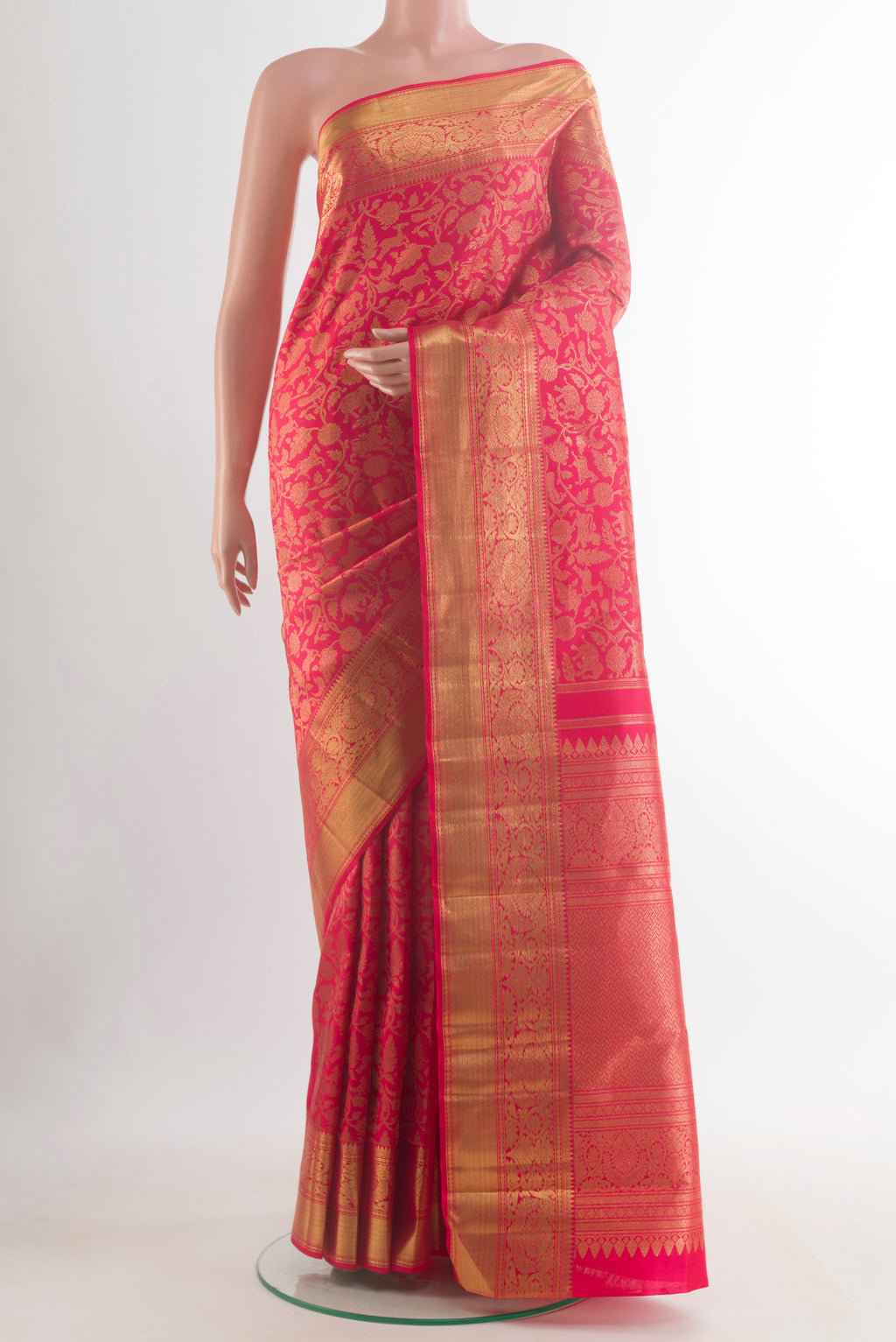 Pure Silk Pure Zari Dark Pink Kanjivaram Saree with Zari Brocade on the body and Zari Border.  displayed on a mannequin