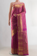 Pure Silk Pure Zari Rani Pink Kanjivaram Saree with Zari Brocade on the body and Zari Border.  displayed on a mannequin