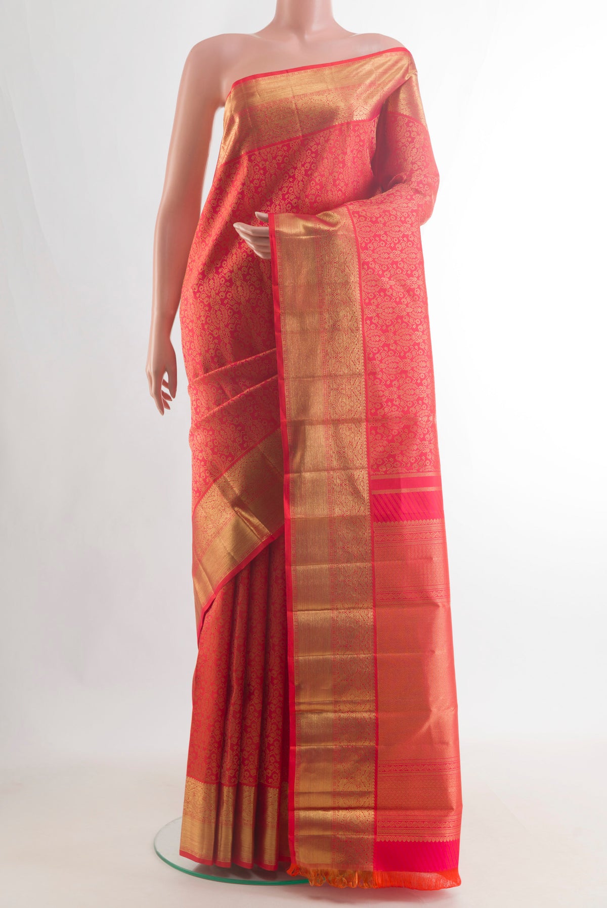 Pure Silk Pure Zari Red Kanjivaram Saree with Zari Brocade on the body and Zari Border.  displayed on a mannequin