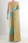 Pure Silk Sea Green Kanjivaram Saree with Plain Body and Zari Border.  displayed on a mannequin