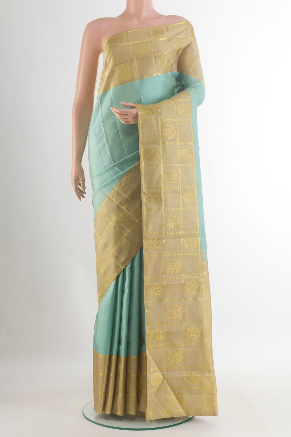 Pure Silk Sea Green Kanjivaram Saree with Plain Body and Zari Border.  displayed on a mannequin