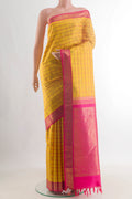 Pure Silk Pure Zari Yellow Kanchipuram Saree with Checked design on the body and Zari Border.  displayed on a mannequin