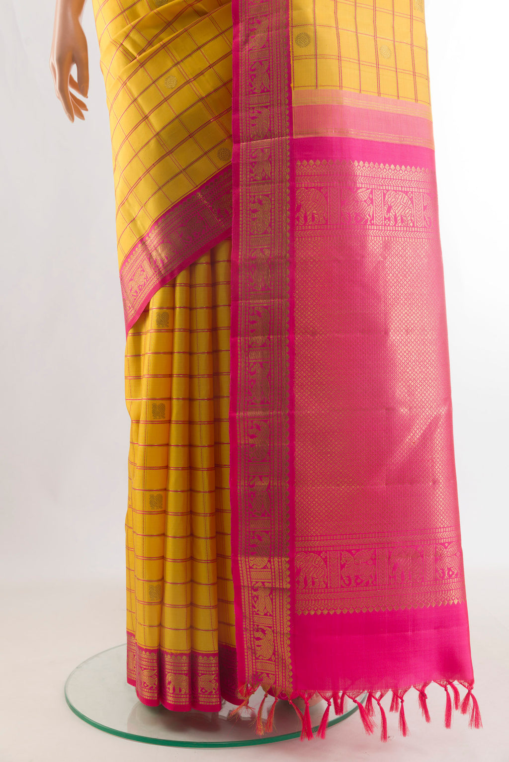 Pleats and pallu of Pure Silk Pure Zari Yellow Kanchipuram Saree with Checked design on the body and Zari Border. 