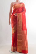 Pure Silk Orange Kanchipuram Saree with Zari Butta on the body and Zari Border.  displayed on a mannequin