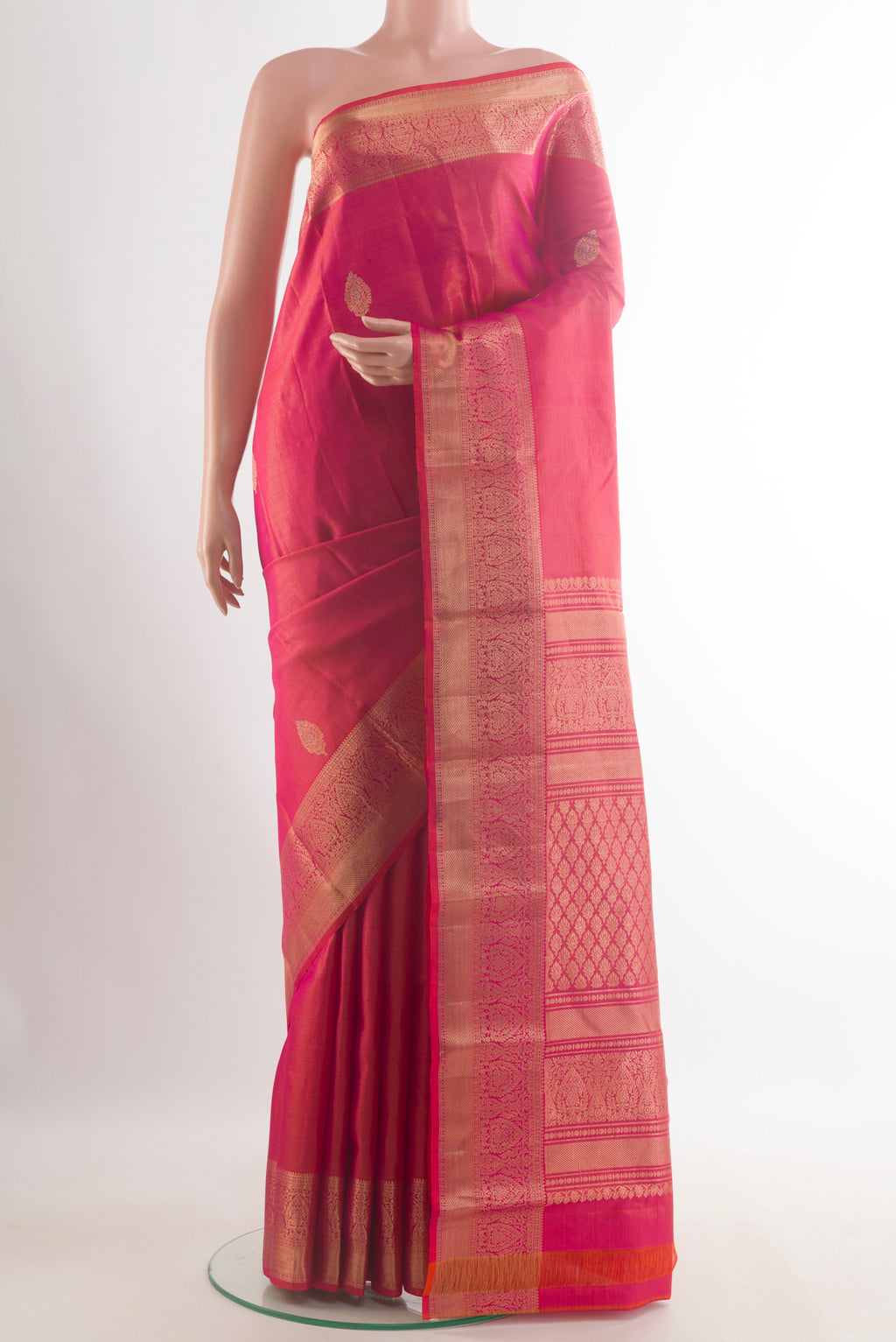 Pure Silk Pink Kanchipuram Saree with Zari Butta on the body and Zari Border.  displayed on a mannequin