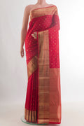 Pure Silk Red Kanjivaram Saree with Zari Butta on the body and Zari Border.  displayed on a mannequin