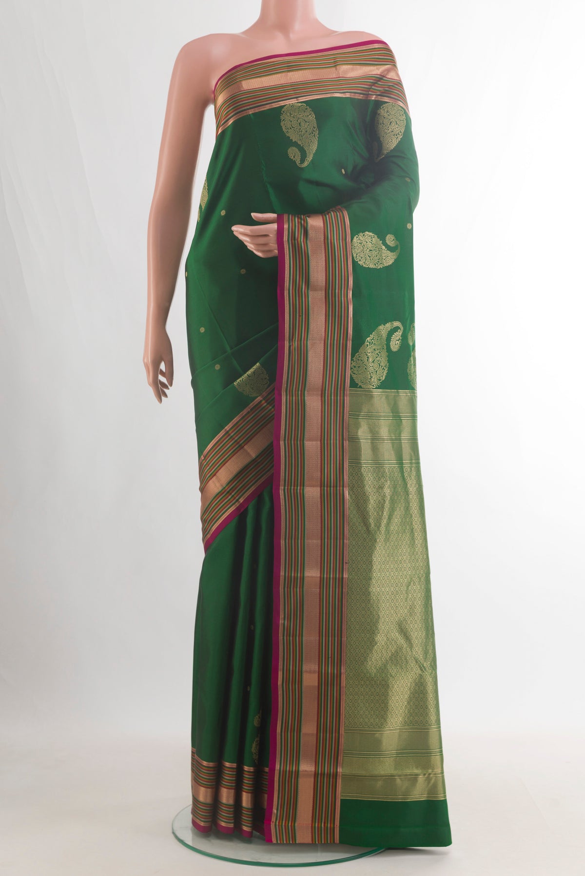 Pure Silk Green Kanchipuram Saree with Zari Butta on the body and Zari Border.  displayed on a mannequin