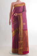 Pure Silk Pink Kanchipuram Saree with Zari Butta on the body and Zari Border.  displayed on a mannequin