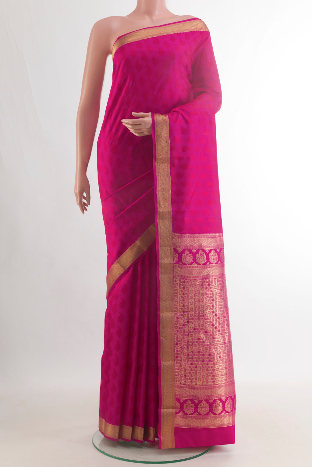 Pure Silk Pink Kanchipuram Saree with Jacquard design on the body and Zari Border.  displayed on a mannequin