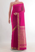 Pure Silk Pink Kanchipuram Saree with Jacquard design on the body and Zari Border.  displayed on a mannequin