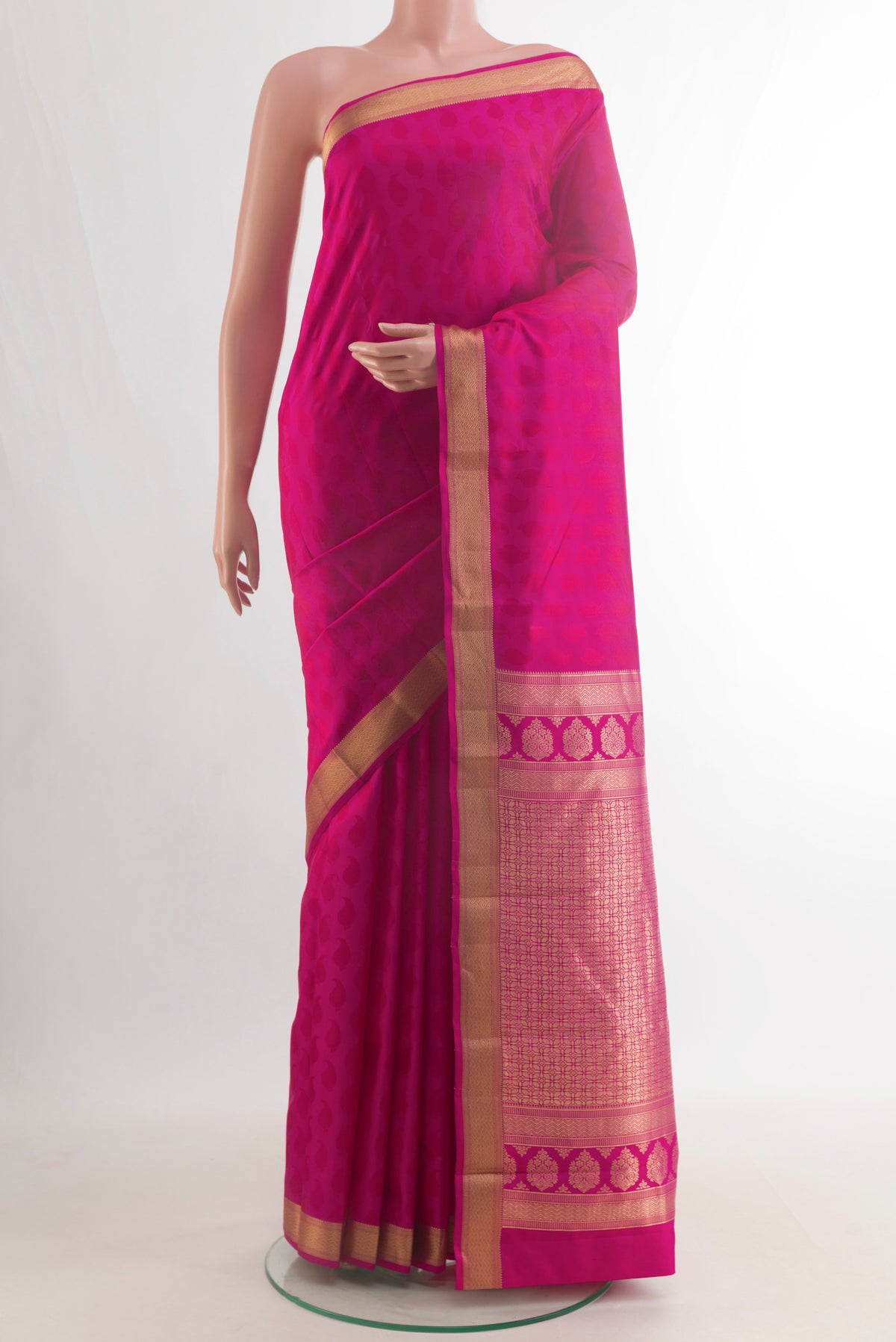 Pure Silk Pink Kanchipuram Saree with Jacquard design on the body and Zari Border.  displayed on a mannequin