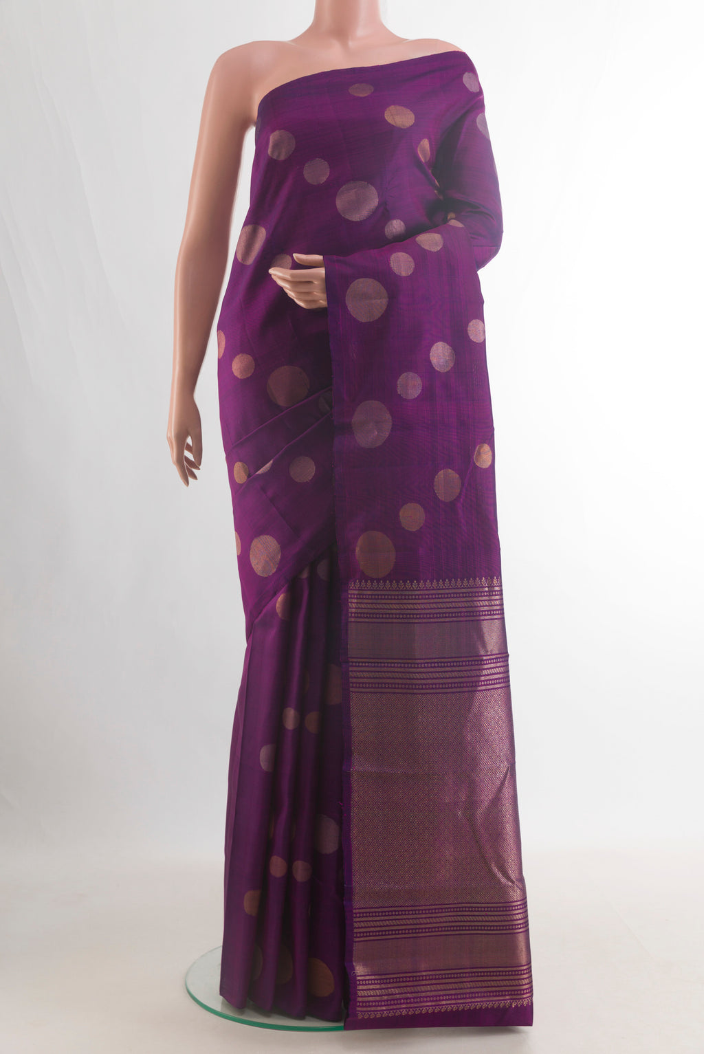 Pure Silk Purple Kanjivaram Saree with Zari Butta on the body and Without Border.  displayed on a mannequin