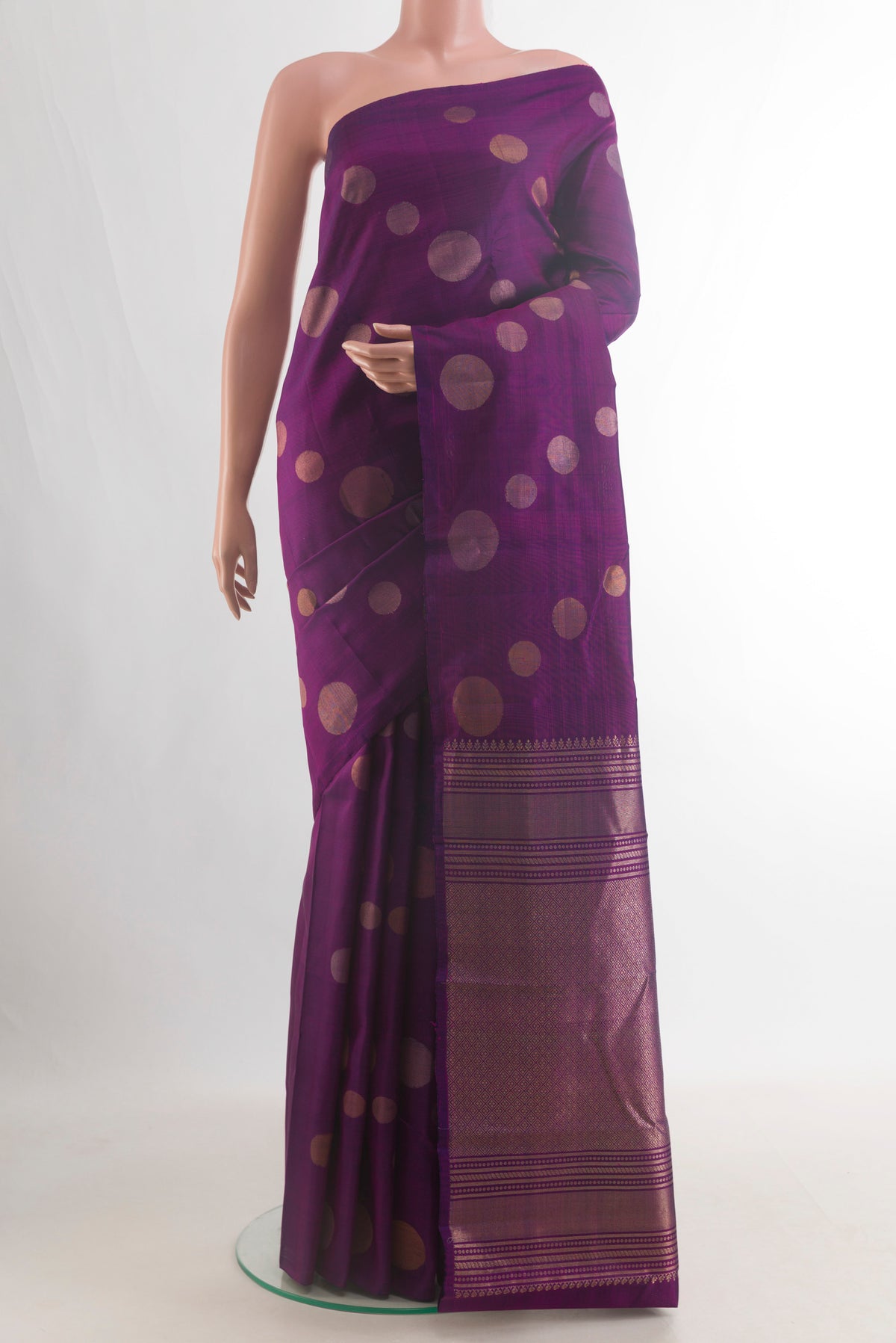 Pure Silk Purple Kanjivaram Saree with Zari Butta on the body and Without Border.  displayed on a mannequin