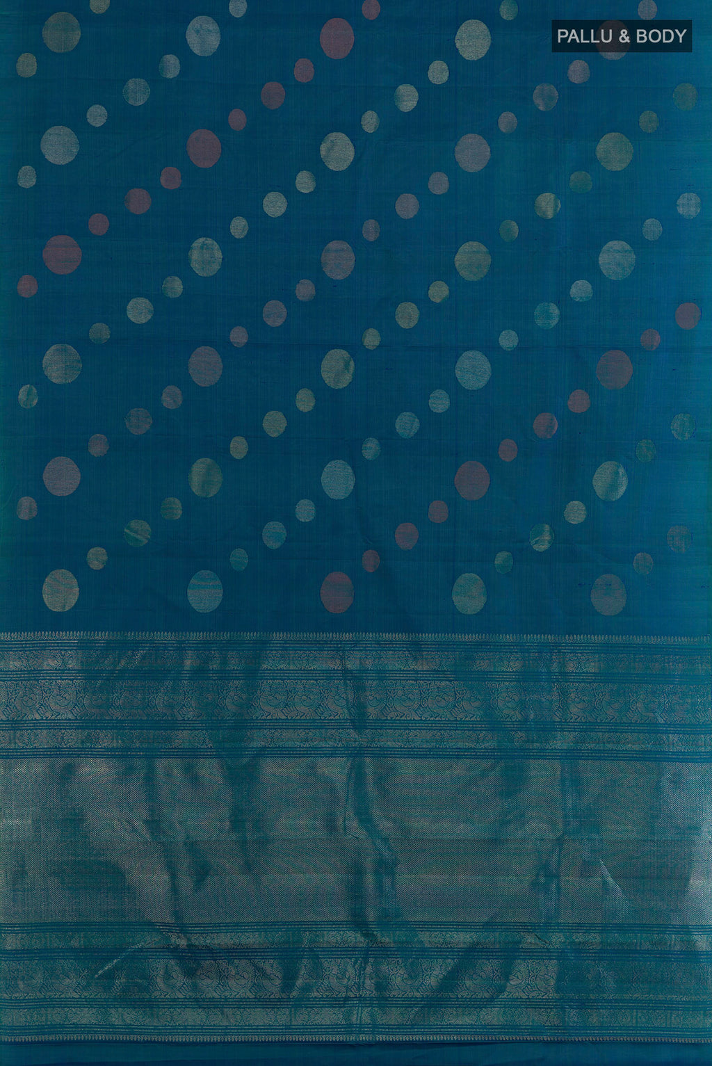 Flat view of Pure Silk Peacock Blue Kanjivaram Saree with Zari Butta on the body and Without Border. 