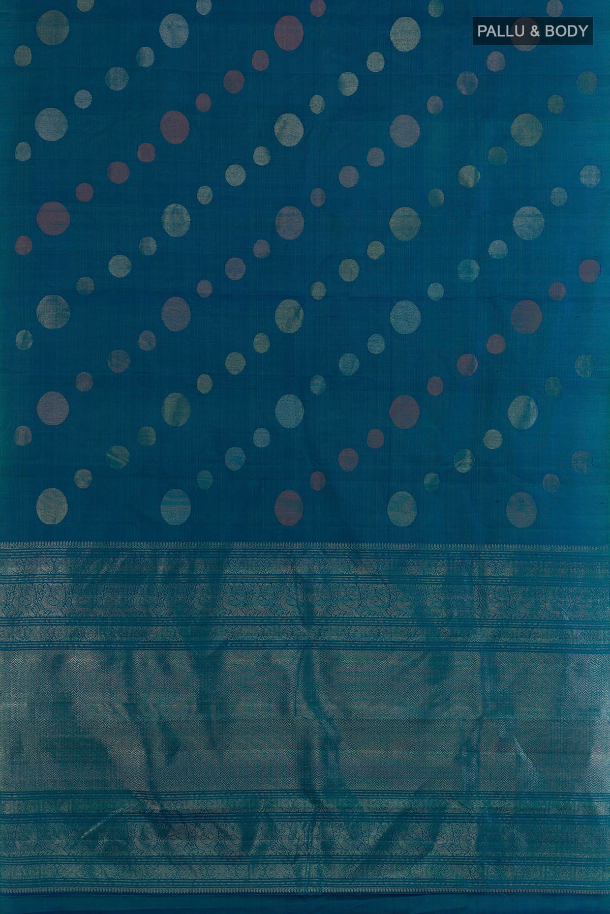 Flat view of Pure Silk Peacock Blue Kanjivaram Saree with Zari Butta on the body and Without Border. 