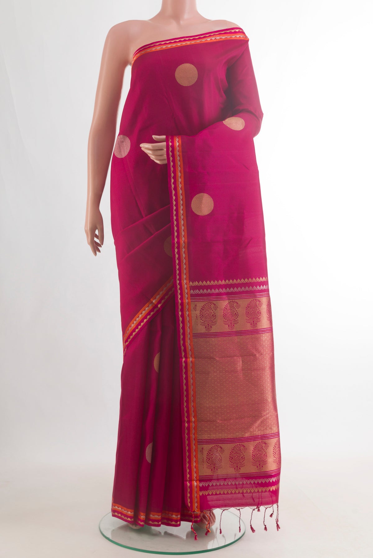 Pure Silk Pink Kanchipuram Saree with Zari Butta on the body and Zari Border.  displayed on a mannequin