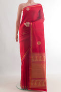 Pure Silk Red Kanchipuram Saree with Zari Butta on the body and Zari Border.  displayed on a mannequin