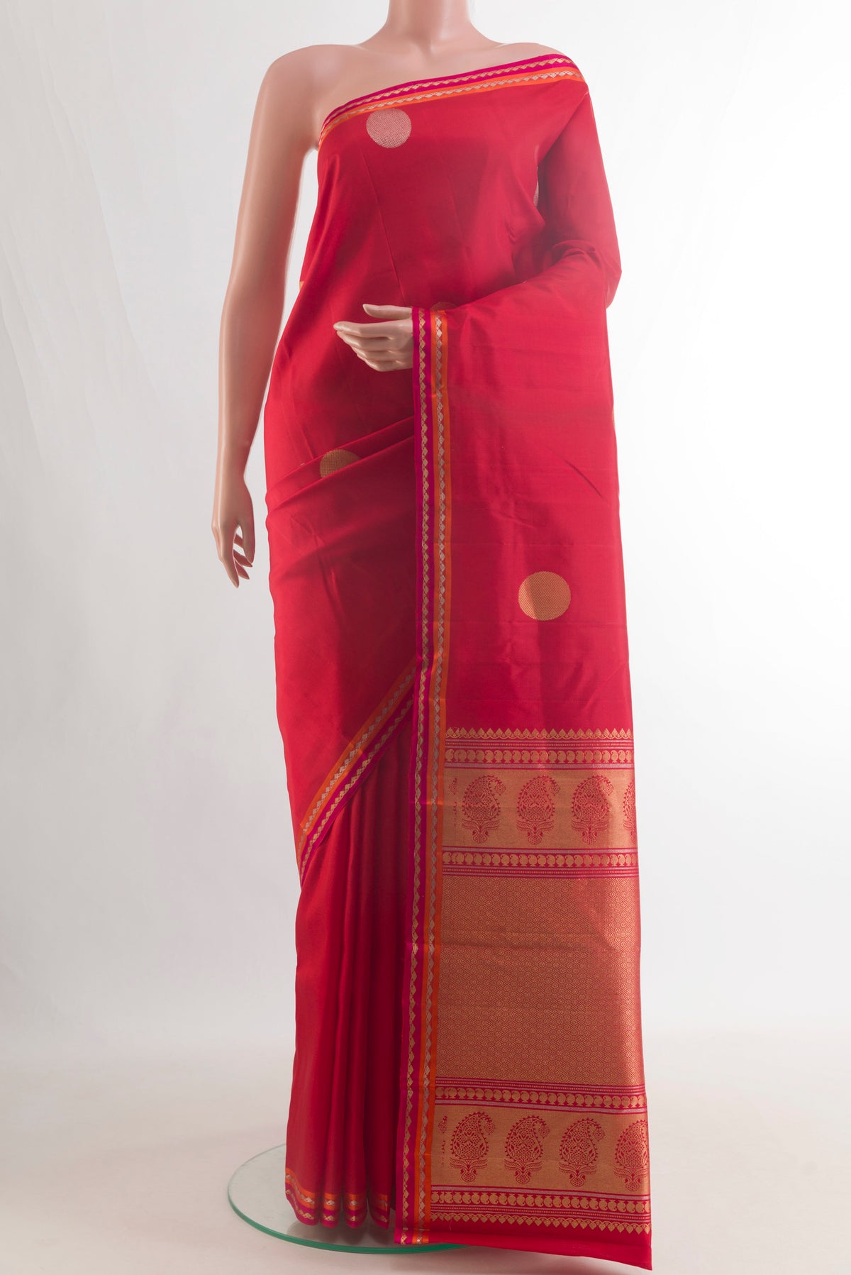 Pure Silk Red Kanchipuram Saree with Zari Butta on the body and Zari Border.  displayed on a mannequin