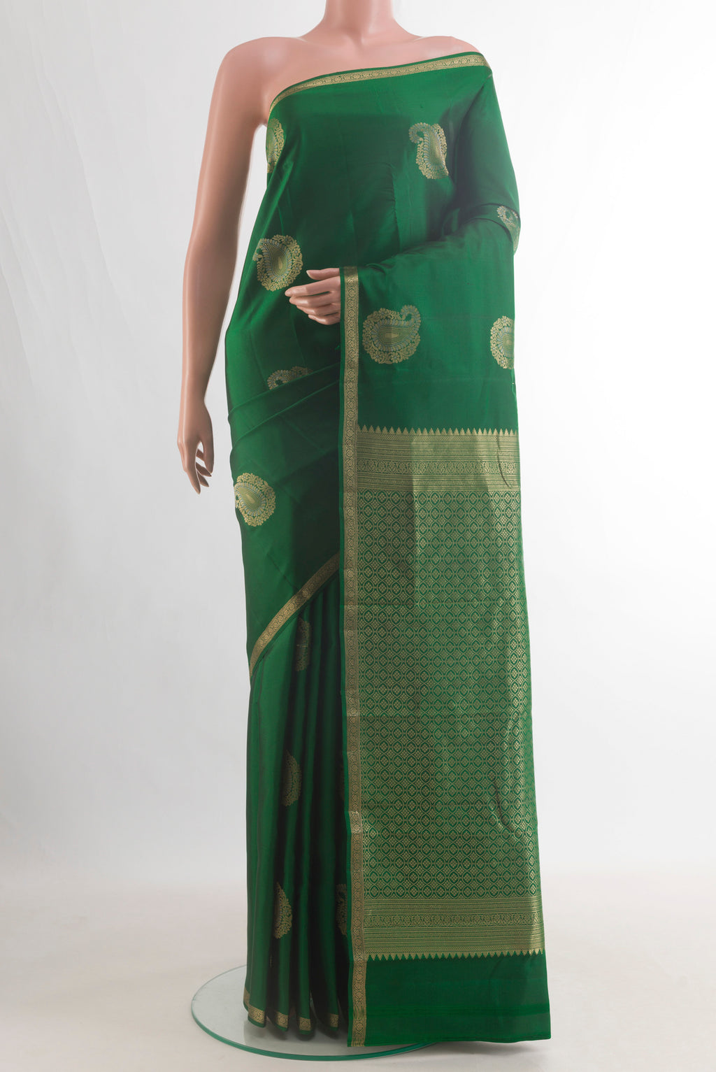 Pure Silk Green Kanchipuram Saree with Zari Butta on the body and Zari Border.  displayed on a mannequin