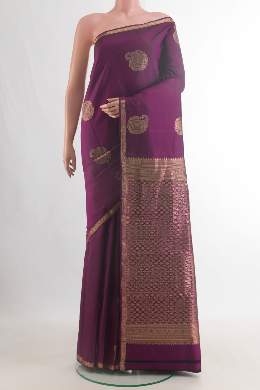 Pure Silk Purple Kanchipuram Saree with Zari Butta on the body and Zari Border.  displayed on a mannequin