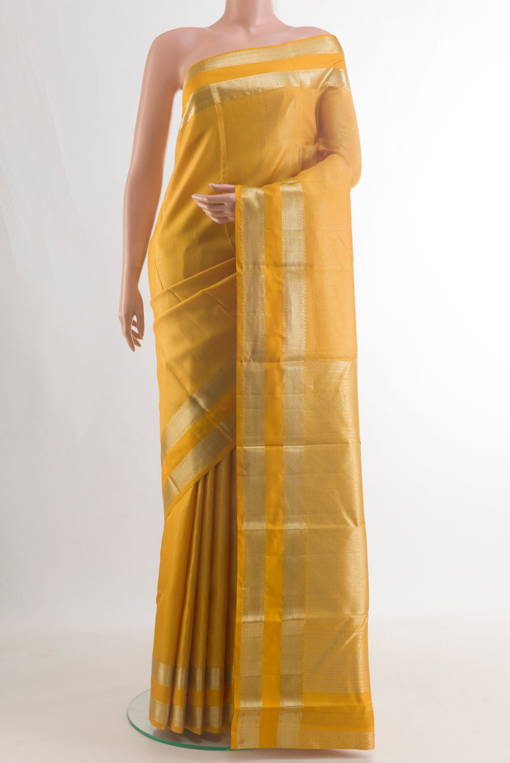 Pure Silk Mustard Kanchipuram Saree with Stripes on the body and Zari Border.  displayed on a mannequin