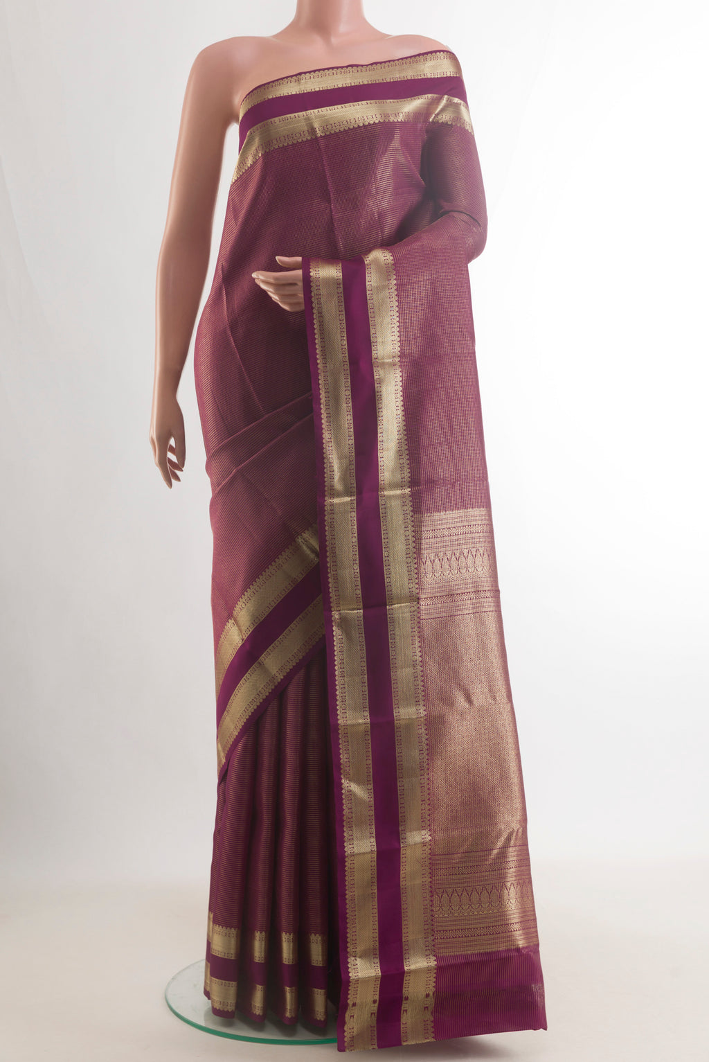 Pure Silk Maroon Kanchipuram Saree with Checked design on the body and Zari Border.  displayed on a mannequin
